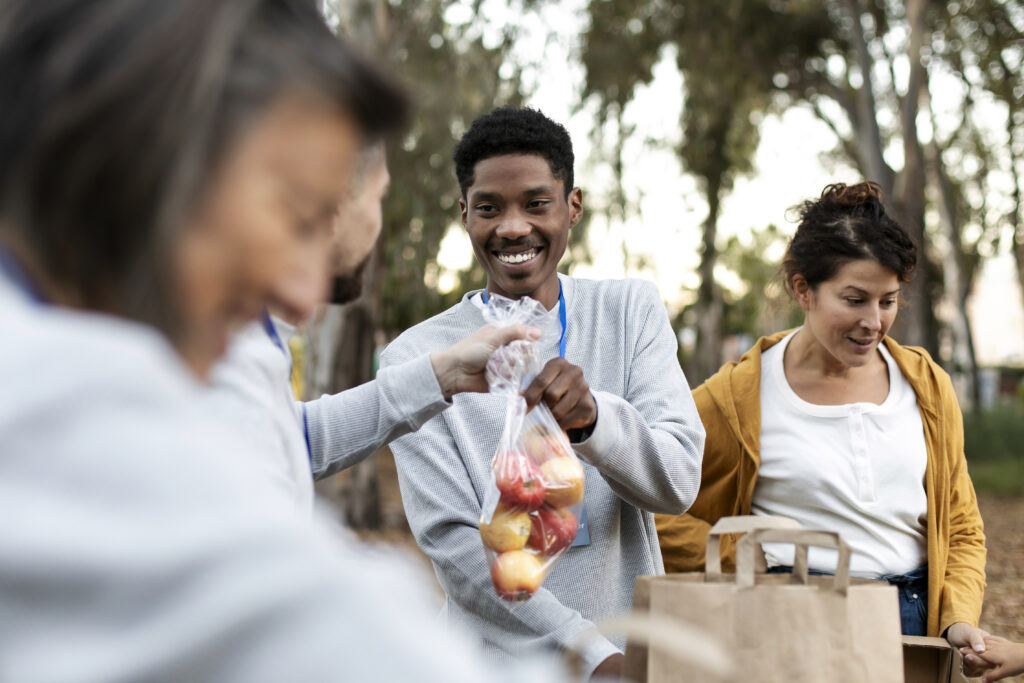 close-up-volunteers-collecting-food